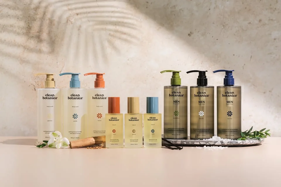 Clean Botanicals product collection styled with warm light and palm shadows